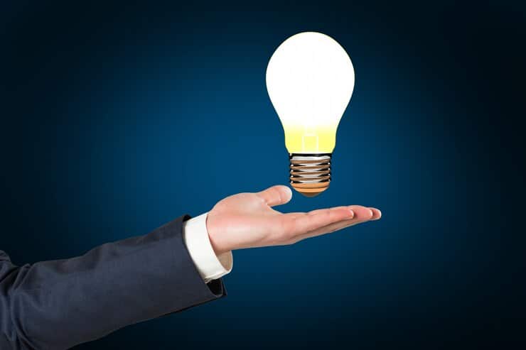 hand-holding-lit-bulb_1134-181